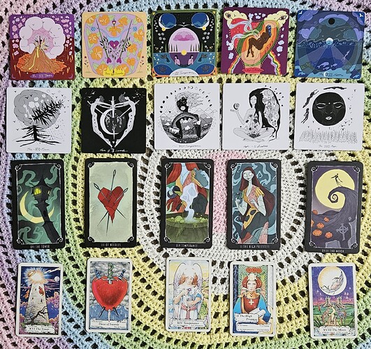 Four rows of tarot cards are laid out displaying, from left to right, The Tower, The Three of Swords, Temperance, The High Priestess, and The Moon from their respective decks.