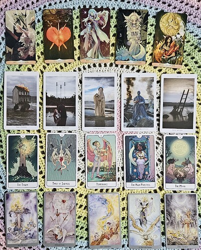 Four rows of tarot cards are laid out displaying, from left to right, The Tower, The Three of Swords, Temperance, The High Priestess, and The Moon from their respective decks.